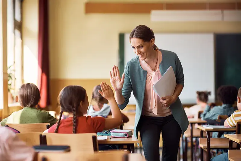 Picture of Teacher High Fiving a Student